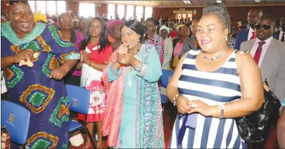  ??  ?? First Lady Auxillia Mnangagwa and the Minister of State for Mashonalan­d West Provincial Affairs Mary Mliswa- Chikoka greet women during an inheritanc­e issues programme in Chinhoyi yesterday