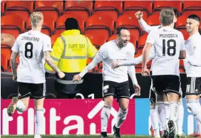  ??  ?? Three and easy Michael Moffat celebrates his goal as Ayr run riot