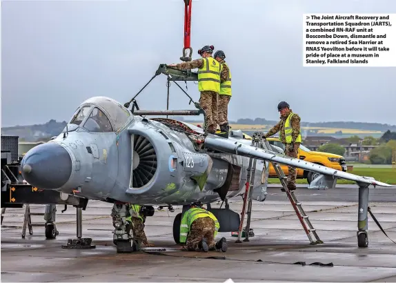  ?? LPhot Dan Rosenbaum ?? > The Joint Aircraft Recovery and Transporta­tion Squadron (JARTS), a combined RN-RAF unit at Boscombe Down, dismantle and remove a retired Sea Harrier at RNAS Yeovilton before it will take pride of place at a museum in Stanley, Falkland Islands