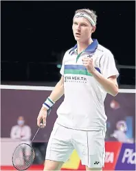  ??  ?? Viktor Axelsen celebrates a point against Kantaphon Wangcharoe­n.