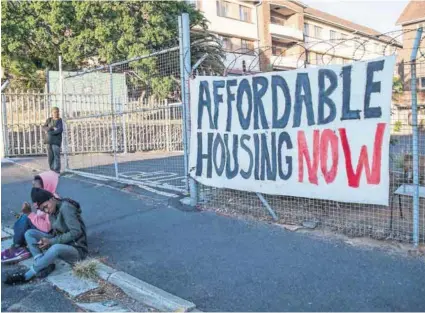  ?? Photo: Ashraf Hendricks/GroundUp ?? Cape of storms: Reclaim the City activists occupy the Woodstock Hospital, one of the central Cape Town sites they want earmarked for affordable housing.