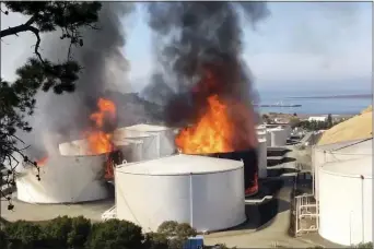  ?? HENRY WOFFORD — NAPA COUNTY SHERIFF’S OFFICE VIA AP ?? In this image from video provided by the Napa County Sheriff’s Office, tanks are on fire at an oil storage facility Tuesday viewed from Rodeo, Calif.