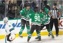  ?? Cooper Neill / Associated Press ?? Dallas right wing Brett Ritchie (25) celebrates with Jason Spezza and Devin Shore after scoring against the Sharks.