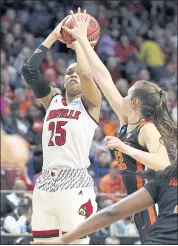  ?? JAMES CRISP — ASSOCIATED PRESS ?? Louisville’s Asia Durr shoots while pressured by Oregon State’s Kat Tudor during the Cardinals’ win on Sunday.