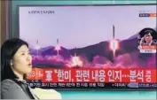  ?? Jung Yeon-je AFP/Getty Images ?? A TELEVISION at a Seoul railway station shows file footage of a North Korean missile launch.