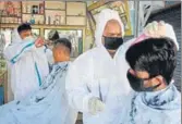  ?? SANT ARORA/HT ?? Two men getting a haircut at a shop in the Sector-11 rehri market in Panchkula on Sunday.