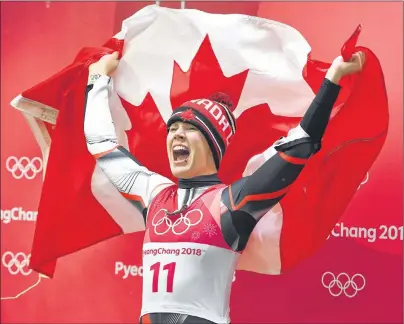  ?? THE CANADIAN PRESS/JONATHAN HAYWARD ?? Canadian luger Alex Gough, of Calgary, celebrates winning the bronze medal in women’s luge at the Pyeongchan­g 2018 Winter Olympic Games in South Korea, Tuesday. Gough captured Canada’s first-ever medal in women’s luge.