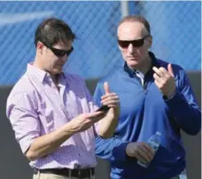  ?? STEVE RUSSELL/TORONTO STAR FILE PHOTO ?? Jays GM Ross Atkins, left, here with team president Mark Shapiro, said he is heading to the winter meetings focused on fulfilling his to-do list.