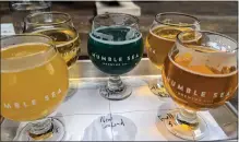  ?? ?? Humble Sea Brewing offers about 20 beers, including “Super Pops! Tropical Blue,” a smoothie beer that comes in a deep green color.