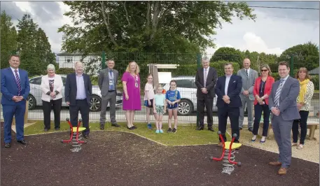  ??  ?? Cathaoirle­ach of Wicklow County Council Irene Winters is helped by local children to officially open the new playground in Roundwood last week.