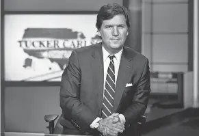  ?? RICHARD DREW/ AP ?? Fox News Channel's prime- time opinion programmin­g, which includes a show hosted by Tucker Carlson, has performed better than its daytime news programmin­g during the network's slide from the No. 1 viewer ranking after the November election.