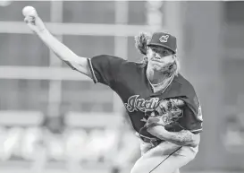  ??  ?? Indians starter Mike Clevinger allowed a pair of singles over seven-plus innings while striking out eight Astros. He walked two and didn’t allow a run.