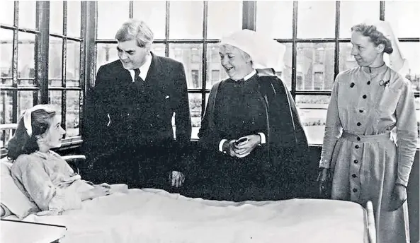  ??  ?? Shared birthday: Jane Cohen, left and below, who was born on July 5 1948. Above, Aneurin Bevan talks to the NHS’S first patient, Sylvia Diggory, 13, at Trafford General, Manchester, the first NHS hospital