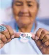  ?? ASSOCIATED PRESS FILE PHOTO ?? Mildred James of Sanders, Ariz., shows off her ‘I Voted’ sticker in August in Window Rock, Ariz. The Navajo Nation is suing Arizona counties over what it says were unequal opportunit­ies for tribal members to correct signature deficienci­es on early ballots in Arizona’s general election.