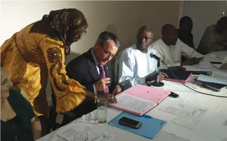  ??  ?? SIGNING AN agreement in Senegal in 2016.