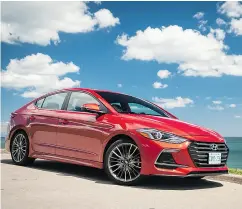  ?? NICK TRAGIANIS / DRIVING. CA ?? Above, the 2017 Hyundai Elantra GT sedan. Below, the base starts at about $25,000, and you get a leather interior, Apple CarPlay and Android Auto.