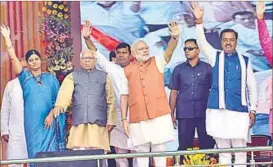  ?? RAJESH KUMAR/HT PHOTO ?? Prime Minister Narendra Modi being welcomed at the DLW ground in Varanasi on Monday. Also seen in the picture are UP Governor Ram Naik, union minister Anupriya Patel and BJP state unit president Keshav Prasad Maurya.