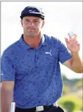  ?? Mike Ehrmann / Getty Images ?? Bryson DeChambeau reacts to a putt on the 17th hole during the second round of the Hero World Challenge on Friday.