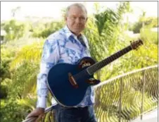  ?? MATT SAYLES — THE ASSOCIATED PRESS FILE ?? In this photo, musician Glen Campbell poses for a portrait in Malibu Campbell, the grinning, high-pitched entertaine­r who had such hits as “Rhinestone Cowboy” and spanned country, pop, television and movies, died Tuesday. He was 81. Campbell announced...