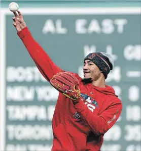  ?? ELISE AMENDOLA THE ASSOCIATED PRESS ?? Boston Red Sox's Mookie Betts works out at second base at Fenway Park, Sunday, Oct. 21, in Boston. The Red Sox are preparing for Game 1 of the baseball World Series against the Los Angeles Dodgers scheduled for Tuesday in Boston.