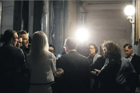  ?? MICHAEL BELL ?? Brad Wall speaks to reporters during his final scrum as Saskatchew­an premier at the legislativ­e building on Wednesday.