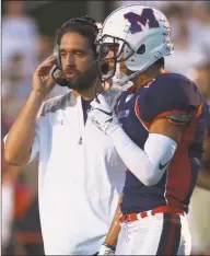  ?? Erik Trautmann / Hearst Connecticu­t Media ?? McMahon football coach Jeff Queiroga during a 2018 game against Darien.