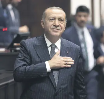  ??  ?? President Recep Tayyip Erdoğan salutes his party members during a parliament­ary group meeting in Ankara, Oct. 2, 2018.
