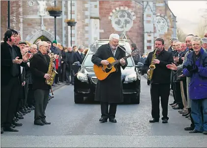 ?? Photo by John Cleary. ?? Musicians George Raymond, Cllr. Johnnie Wall, and Mossy O'shea, led the Guard of Honour of Musicians at the funeral of Billy Curtin at St. John's Church on Saturday.
