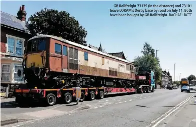  ?? RACHAEL BOTT. ?? GB Railfreigh­t 73139 (in the distance) and 73101 leave LORAM’s Derby base by road on July 11. Both have been bought by GB Railfreigh­t.