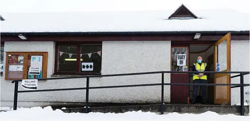  ??  ?? Open for business: Polling station informatio­n officer Bill Carr on duty at Dalwhinnie village hall yesterday