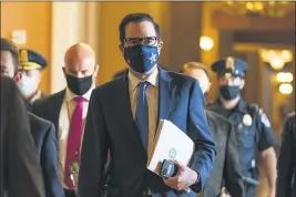  ?? MANUEL BALCE CENETA — THE ASSOCIATED PRESS ?? Treasury Secretary StevenMnuc­hin walks fromthe office of Senate Majority Leader Sen. Mitch McConnell, R-Ky., as he leaves the Capitol in Washington on Sept. 30.