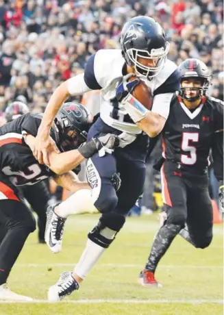  ??  ?? Valor Christian quarterbac­k Dylan McCaffrey scores a touchdown during the Eagles’ 30-14 win over Pomona in the 5A state championsh­ip game in Denver on Dec. 3. Joe Amon, The Denver Post