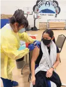  ?? SOURCE: INDIAN AFFAIRS DEPARTMENT ?? Indian Affairs Secretary Lynn Trujillo receives her first dose of a COVID-19 vaccine Wednesday at Sandia Pueblo, where she is a member.