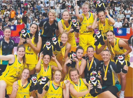  ?? TRIUMPHANT: Darcee Garbin ( and the Emerging Opals celebrate after taking down Japan in the gold medal game at the World University Games. ?? far right)