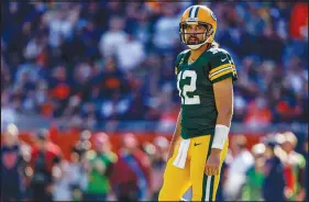  ?? JEFFREY PHELPS / AP ?? Green Bay Packers quarterbac­k Aaron Rodgers walks on the field
Oct. 17 during the Packers game against the Chicago Bears. When news broke that Rodgers tested positive for the coronaviru­s last week and was unvaccinat­ed, he justified his decision to not get vaccinated by speaking out against the highly effective vaccines and spewing a stream of misinforma­tion and junk science.