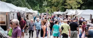  ??  ?? 1
Visitors peruse the booths at Long’s Park Art Festival in 2018. Courtesy Long’s Park Art Festival.