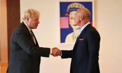  ?? Photograph: Michael M Santiago/Getty Images ?? British PM Boris Johnson greets Amazon founder Jeff Bezos at the UK diplomatic residence in New York City in September 2021.