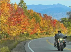  ?? JIM COLE, FILE/THE ASSOCIATED PRESS ?? Peak colors are seen along the Kancamagus Highway in Albany, N.H. The nearby Boulder Loop Trail in Conway offers fall colors and a way to get your steps in while enjoying the foliage.