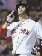  ?? AP PHOTO ?? THINGS LOOKING UP: J.D. Martinez gestures skyward after hitting a home run last night against the Blue Jays at Fenway.
