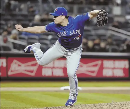  ?? AP PHOTO ?? SPECIAL DELIVERY: Blue Jays pitcher Seung Hwan Oh powers a pitch homeward during Toronto’s win last night over the Yankees in New York.