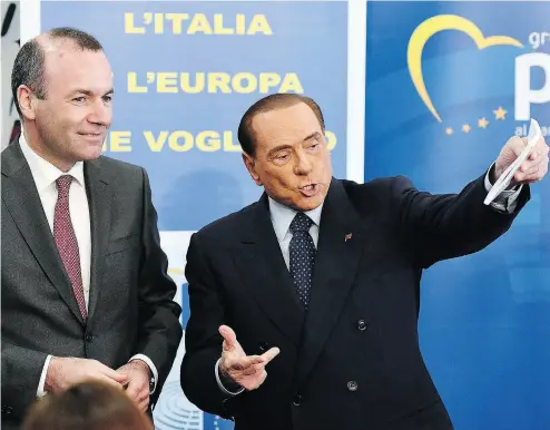  ?? ETTORE FERRARI / ANSA VIA THE ASSOCIATED PRESS ?? Former Italian premier Silvio Berlusconi, right, meets European People’s party president Manfred Weber in Rome on Wednesday. Berlusconi arrived on foot at a piazza where he was greeted by hundreds chanting “Silvio, Silvio.”
