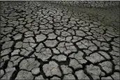  ?? FERNANDO LLANO — THE ASSOCIATED PRESS FILE ?? Dry, cracked land is visible in The Boca reservoir that supplies water to the northern city of Monterrey during a drought in Santiago, Mexico, in July.
