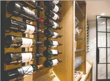  ??  ?? When planning the racks for a home wine cellar, experts say to keep in mind that not all bottles are the same size or shape.
VERANDA ESTATE HOMES