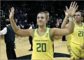  ?? CHRIS PIETSCH - THE ASSOCIATED PRESS ?? FILE - In this Nov. 16, 2019, file photo, Oregon’s Sabrina Ionescu acknowledg­es the crowd with teammates after an NCAA college basketball game against Texas Southern in Eugene, Ore.