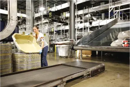  ??  ?? LOUISILLE: In this Nov 20, 2015 photo, a UPS employee works inside the company’s Worldport hub in Louisville, Ky. On Friday, the US government issued the April jobs report. — AP