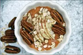  ?? MELISSA D’ARABIAN VIA AP ?? This photo shows a pumpkin and spice breakfast bowl in Bethesda, Md. Loading up the freezer with these bowls is an excellent plan-ahead strategy, whether you’re a mom of four, or you just want to streamline your mornings.