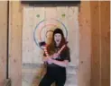  ??  ?? Events manager Jess Shotton at Forged Axe in Whistler’s Function Junction is a great axe-throwing teacher.