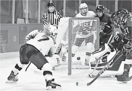  ?? PHOTOS BY ANDREW NELLES/USA TODAY SPORTS ?? U.S. forward Monique Lamoureux-Morando scores against Finland.