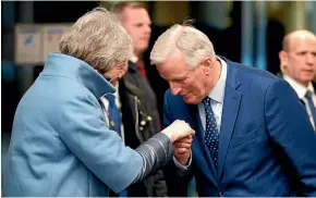  ?? AP ?? British Prime Minister Theresa May is welcomed by European Union’s chief Brexit negotiator Michel Barnier in Strasbourg, France.