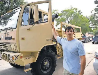  ?? DANIELLE PARHIZKARA­N, USA TODAY NETWORK ?? Nick Sissa bought a military vehicle for the fun of it. He ended up finding its purpose in the flooding after Hurricane Harvey.
